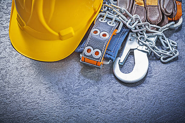 istock Construction safety harness protective gloves building helmet on 520366828