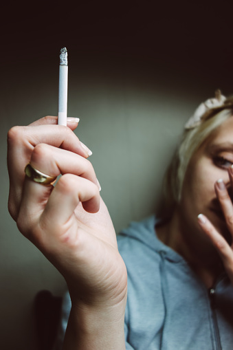 Surreal looking woman smoking