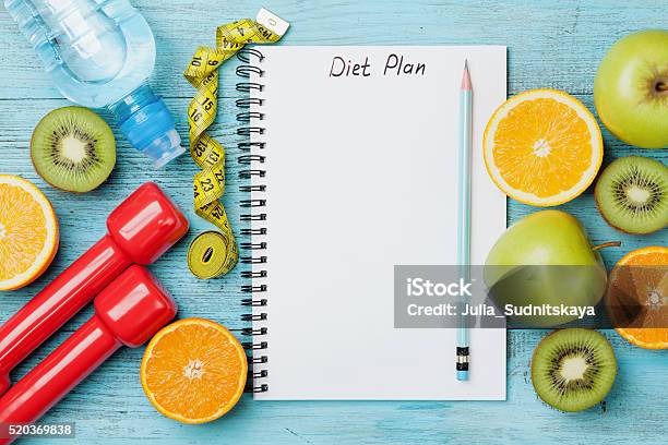 Diet Plan Tape Measure Water Dumbbells And Fruits Detox Concept Stock Photo - Download Image Now