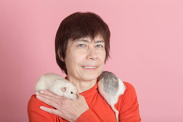istock woman with pet rats 520370916