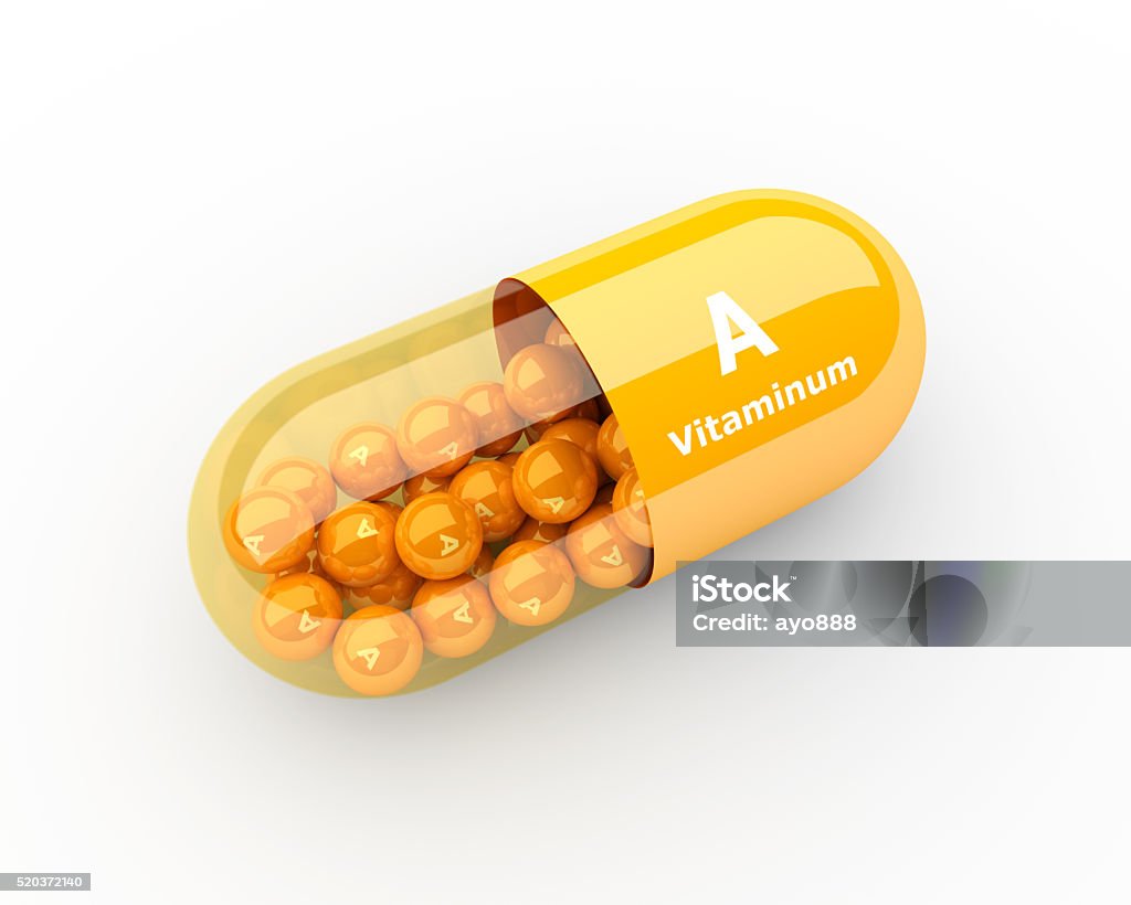 vitamin A capsule lying on desk 3d vitamin A capsule lying on desk Addiction Stock Photo