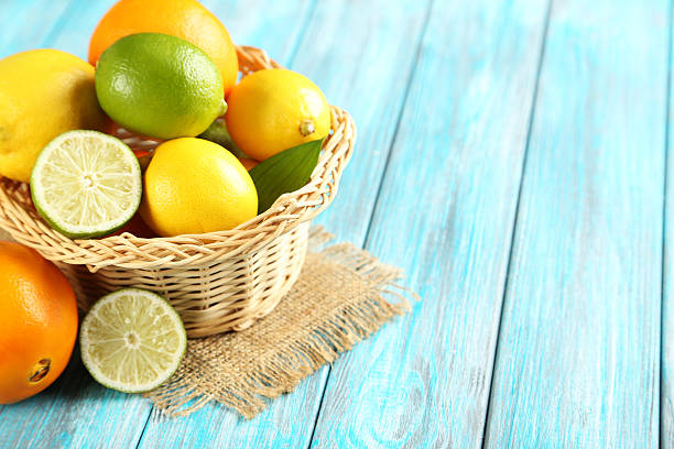 istock Citrus fruits on a blue wooden table 520373656
