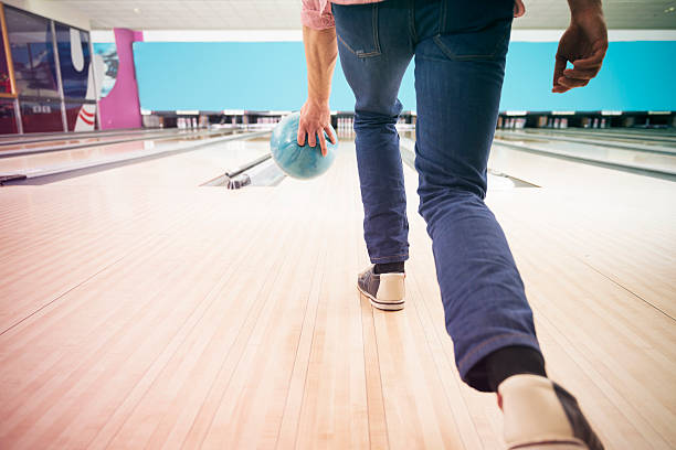 istock Man pushing the bowling ball 520373944