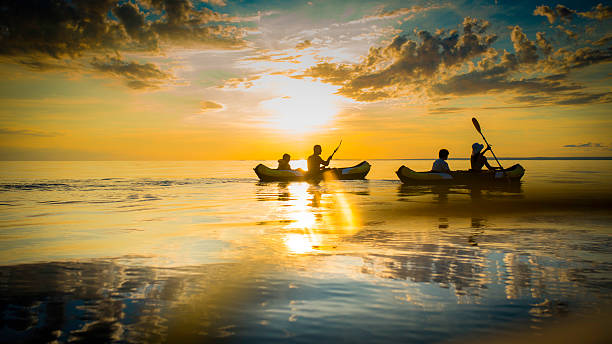 istock Family Sea Kayaking at Sunset 520388877