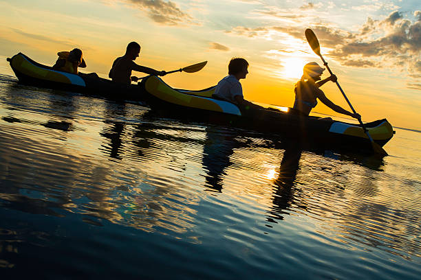 istock Family Sea Kayaking at Sunset 520388881