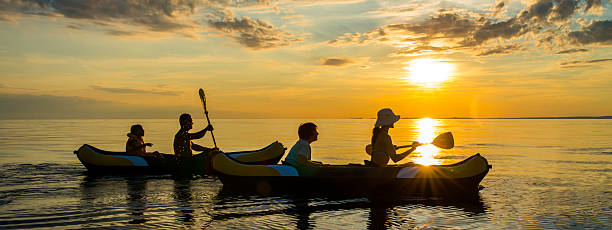 istock Family Sea Kayaking at Sunset 520390601