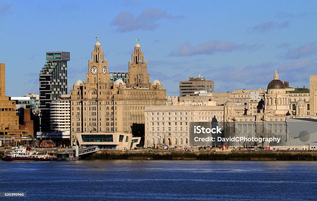 Liverpool Waterfront Liverpool's world famous iconic three graces  waterfront buildings including the Mersey Ferry Liverpool - England Stock Photo