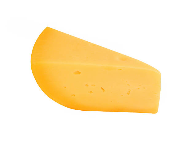 istock Yellow cheese piece taken closeup.Isolated. 520393655