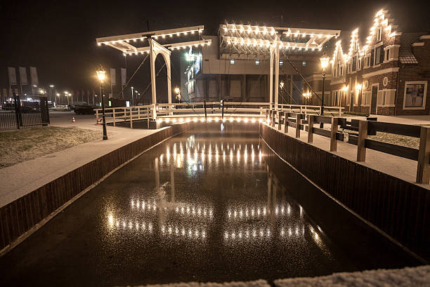 istock drawbridge reflecting in water at winter night 520407547