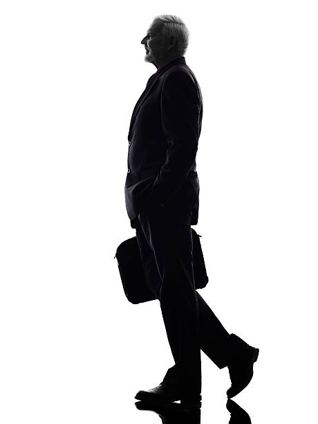 istock senior business man walking silhouette 520408411