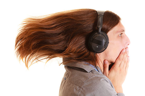 istock man listening to music mp3 relaxing having fun. 520409355
