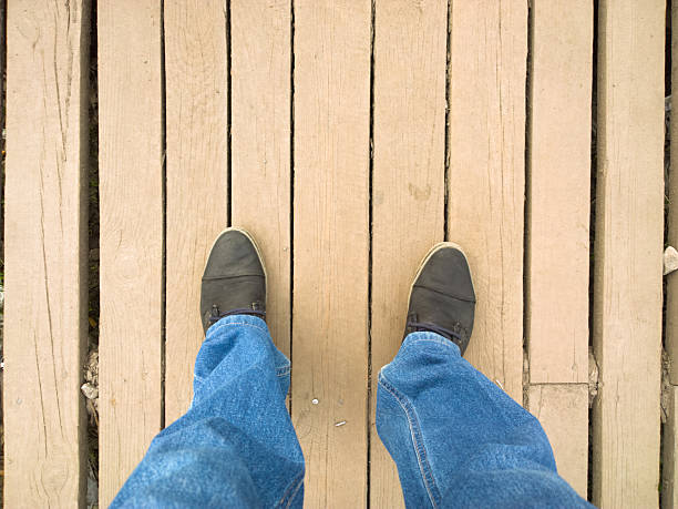 istock Feet on the wooden floor. 520409418