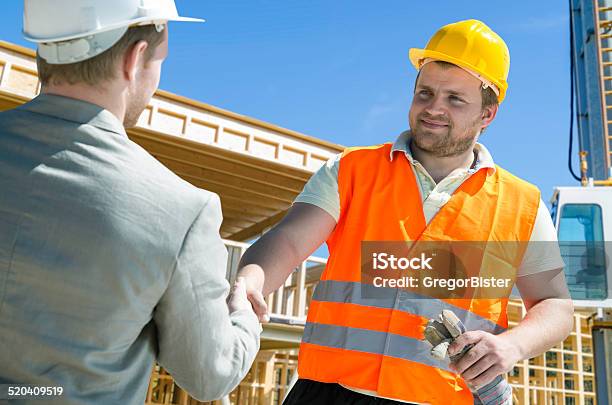 Architect And Construction Worker Shaking Hands Stock Photo - Download Image Now - Construction Industry, Handshake, Suit