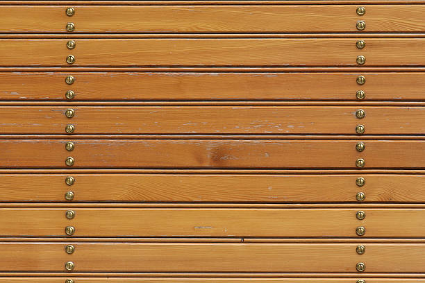 Wooden varnished planks with screws - background #1 stock photo