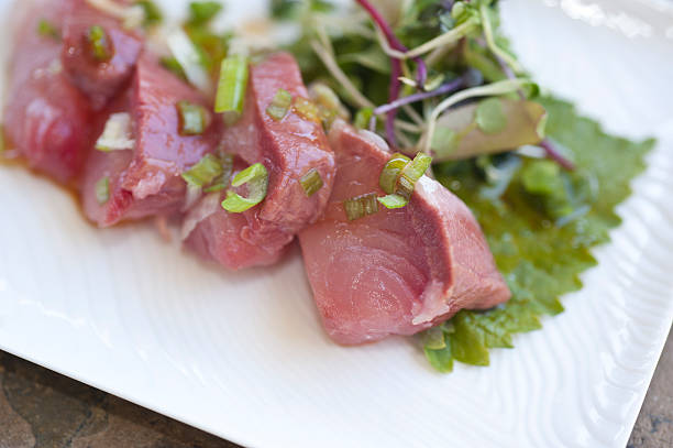 istock Raw tuna Sashimi with greens 520410763