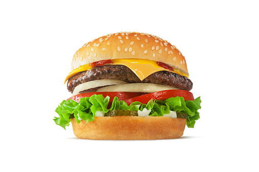 A perfect cheeseburger, perfectly proportioned and styled, shot in a fast food advertising style and isolated on white. Sesame seed bun, visible condensation on tomatoes, onions, pickles, mayo, mustard, ketchup.