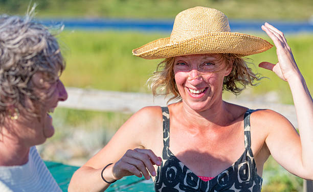 istock Woman Grabs Her Hat on a Windy Day 520411375