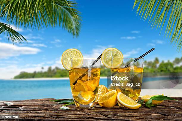 Glasses Of Summer Ice Tea Drink On Beach Stock Photo - Download Image Now - Antioxidant, Beach, Citrus Fruit