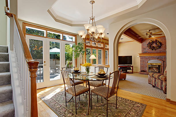 istock Bright dining area with walkout patio in luxury house 520411823