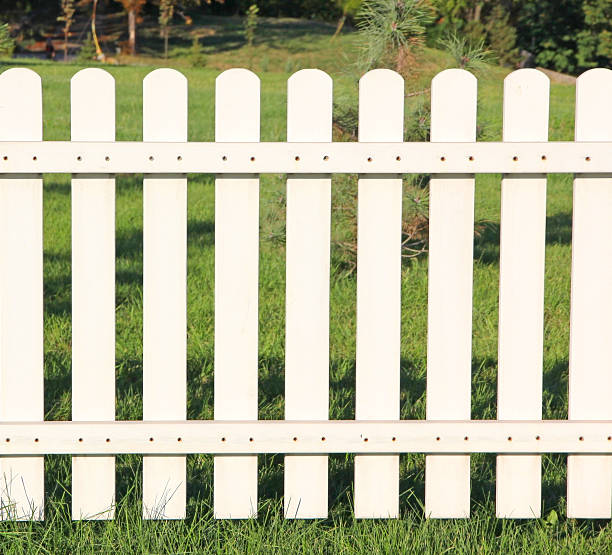 istock White fence taken closeup. 520412403