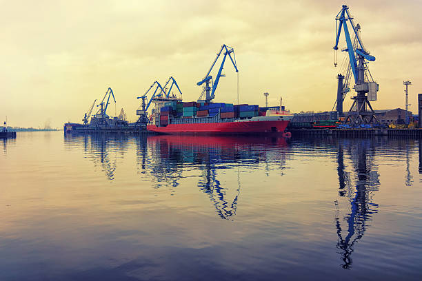 istock Red ship at the port of loading and unloading 520412628