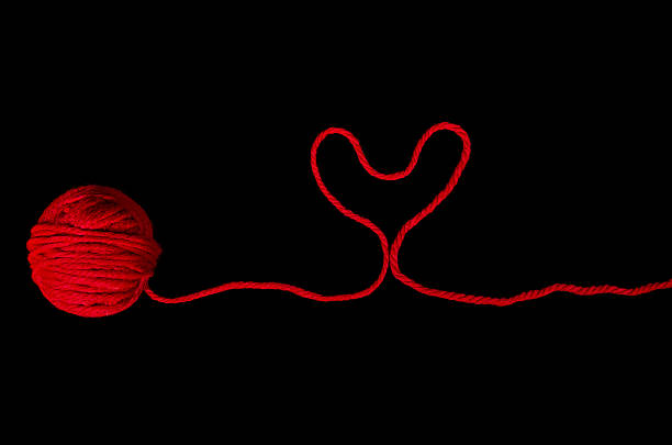istock ball of red yarn with heart 520412645