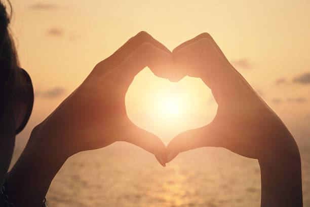 istock Heart shape making of woman hands 520414482