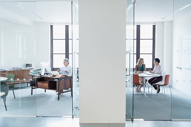istock View through glass partition into modern office 520415060