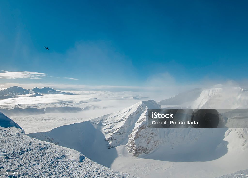 The crater of the volcano Gorely The crater of Gorely volcano, Kamchatka. The photo shows the helicopter Kamchatka Peninsula Stock Photo