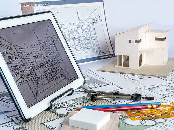istock Architects workspace  with tablet, house model, drawing/ housing development business 520415402