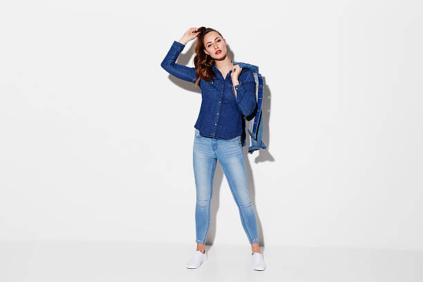 Beautiful model in blue denim clothes, studio Beautiful model in blue denim clothes, studio double denim stock pictures, royalty-free photos & images