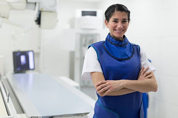 radiologist nurse doing x-ray images. - röntgen cihazı stok fotoğraflar ve resimler