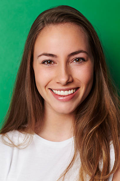 istock Young beautiful woman with confident smile 520419282