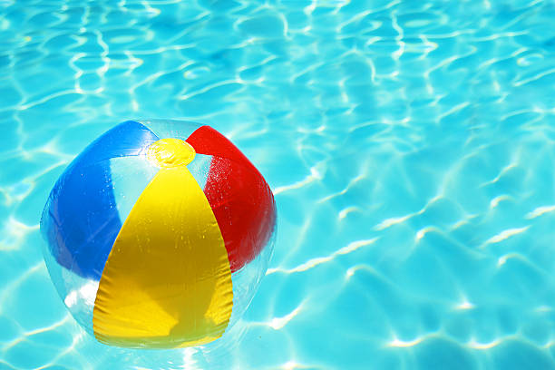 istock Colorful Beach Ball in a Swimming Pool 520419756