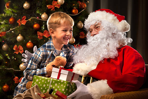 istock Santa Claus and a little boy 520421688