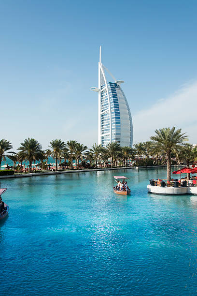 Dubai, United Arab Emirates - March 26, 2016: Burj Al Arab seen from the Madinat Jumeirah district in Dubai during the day. Burj Al Arab is the only seven star hotel in the world.