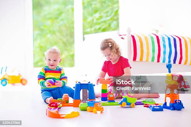 Funny Children Playing With Toy Cars Stock Photo - Download Image Now - Baby - Human Age, Bed - Furniture, Bedding