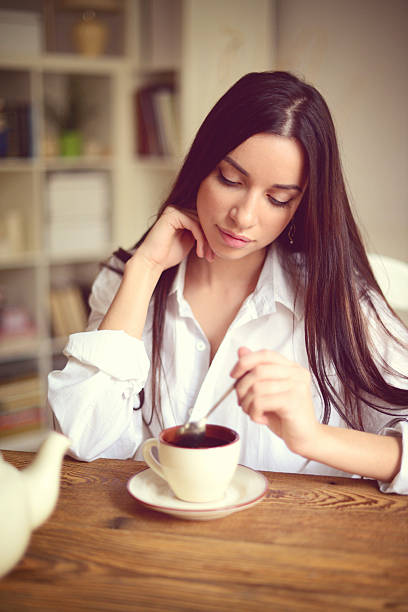 istock young brunette woman in home interior. 520438703