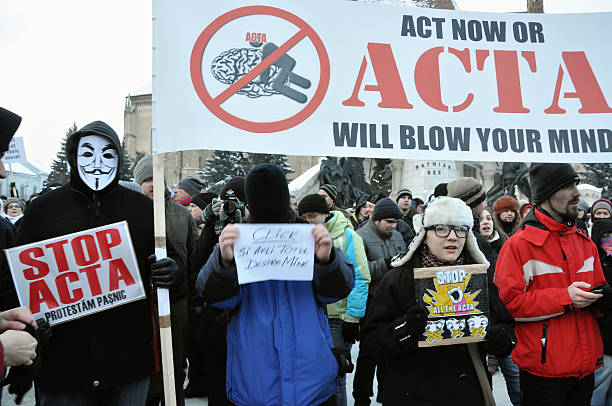 Citizens protesting against Romanian Government Cluj Napoca, Romania - February 11, 2012: Hundreds of people protesting against Acta, against web piracy treaty, and the government in Cluj Napoca ostentation stock pictures, royalty-free photos & images