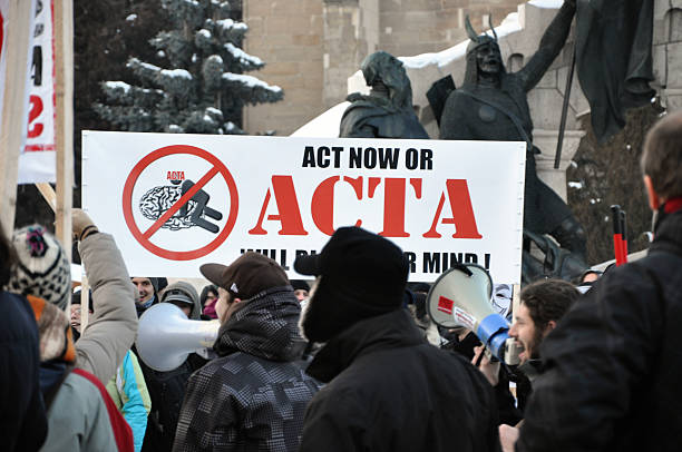 Citizens protesting against Romanian Government Cluj Napoca, Romania - February 11, 2012: Hundreds of people protesting against Acta, against web piracy treaty, and the government in Cluj Napoca ostentation stock pictures, royalty-free photos & images