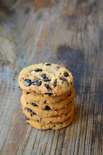 istock Tasty chocolate cookies on wooden table 520441877