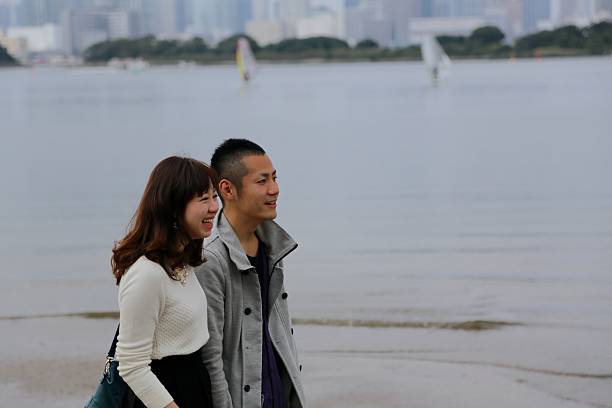 istock Couple waking on the beach 520443007
