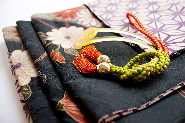 kimono This is a Japanese kimono and an accessory in Japanese dress. kimino stock pictures, royalty-free photos & images