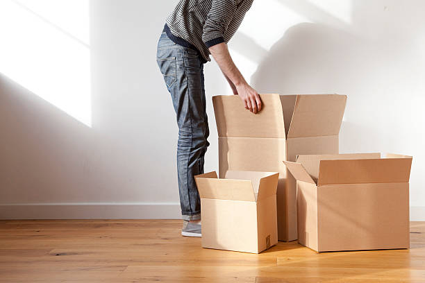 Young man moving house stock photo