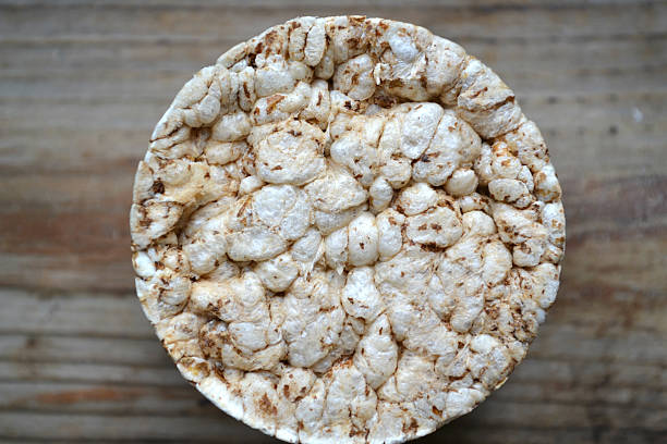 istock Round rice cakes on wooden table 520466101