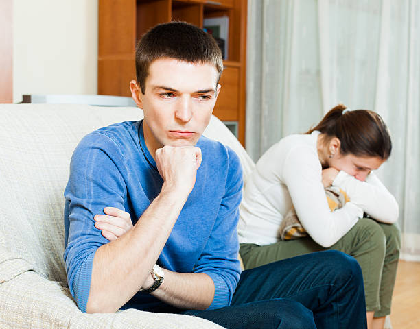 istock Sad guy against angry woman 520466145