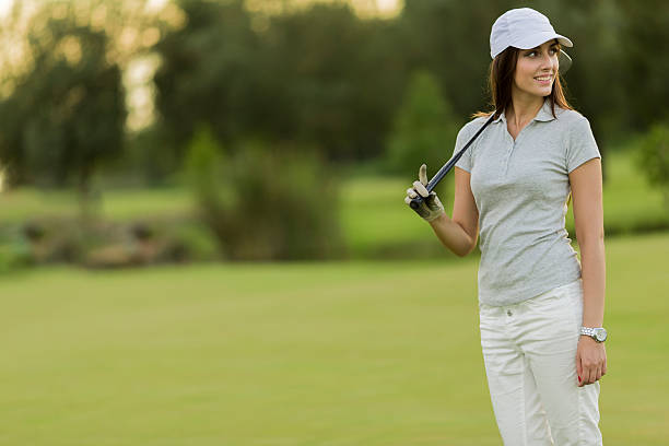 istock Young woman playing golf 520466179