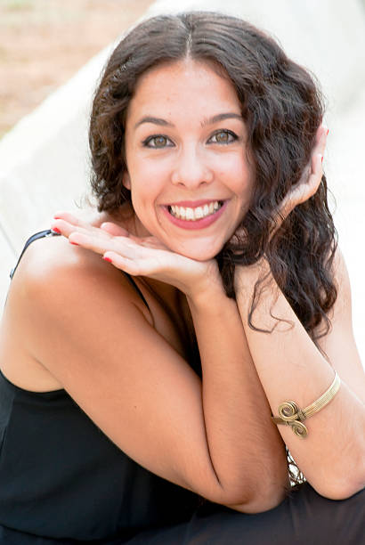 istock Beautiful woman in a park 520467365
