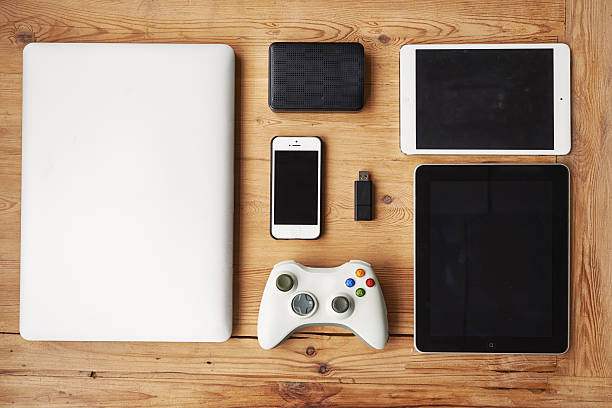 Play is the highest form of research High angle shot of wireless technology on a wooden table wooden flash drive stock pictures, royalty-free photos & images