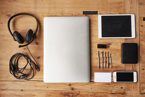 High angle shot of wireless technology on a wooden table